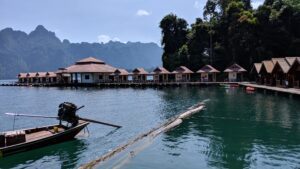 Floating bungalow with longtail boat