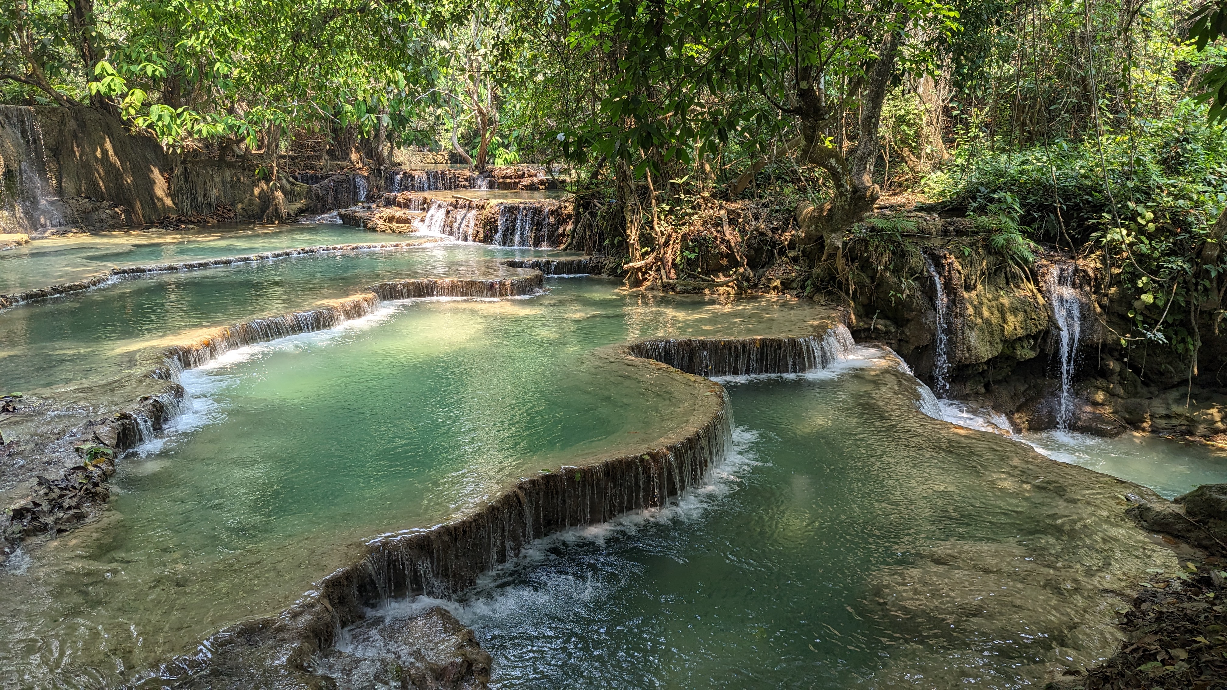 rockpools flowing into each other at kuang si falls